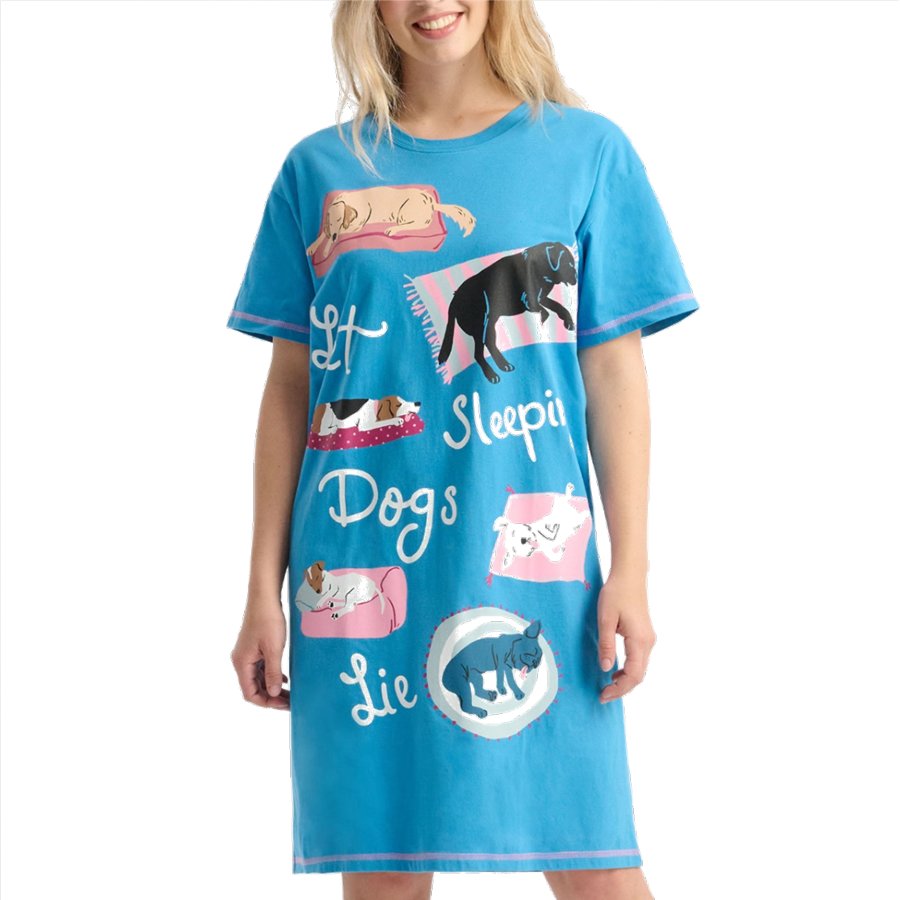 Woman wearing a blue nightshirt with dog illustrations and text on a white background