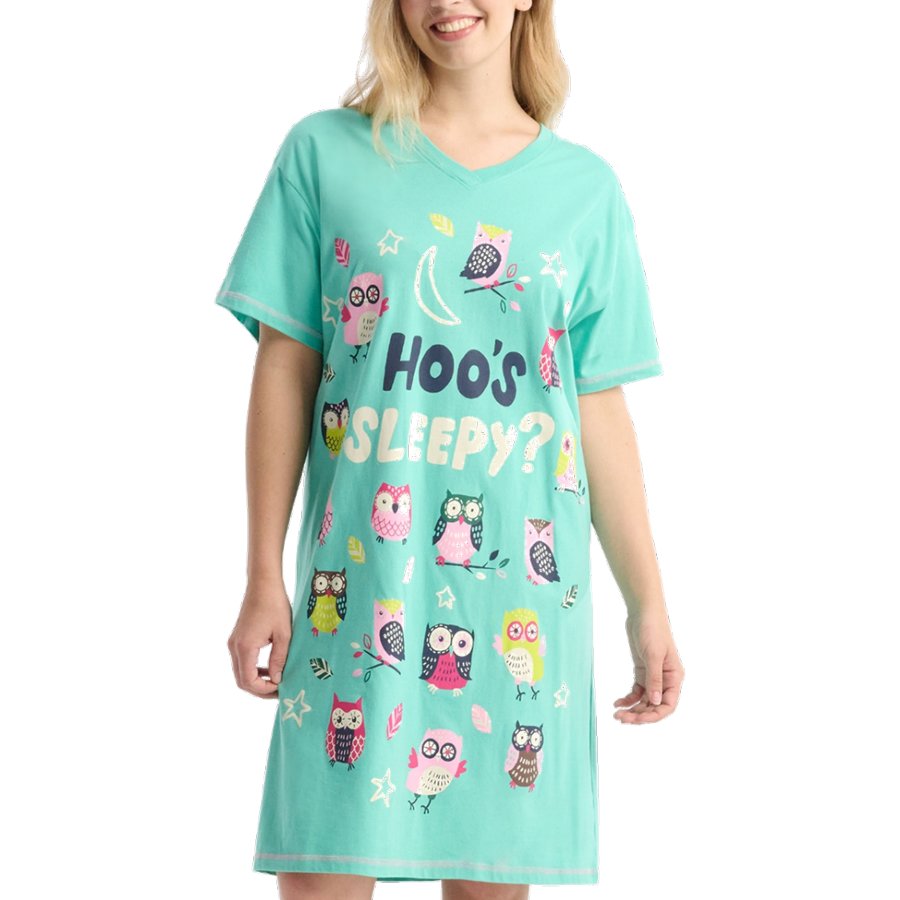 Woman wearing a teal nightshirt with owl patterns and text on a white background