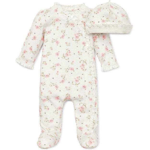 Baby onesie with floral pattern and matching hat on a white background