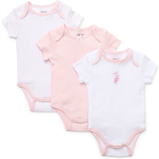 Three baby bodysuits with different patterns on a white background
