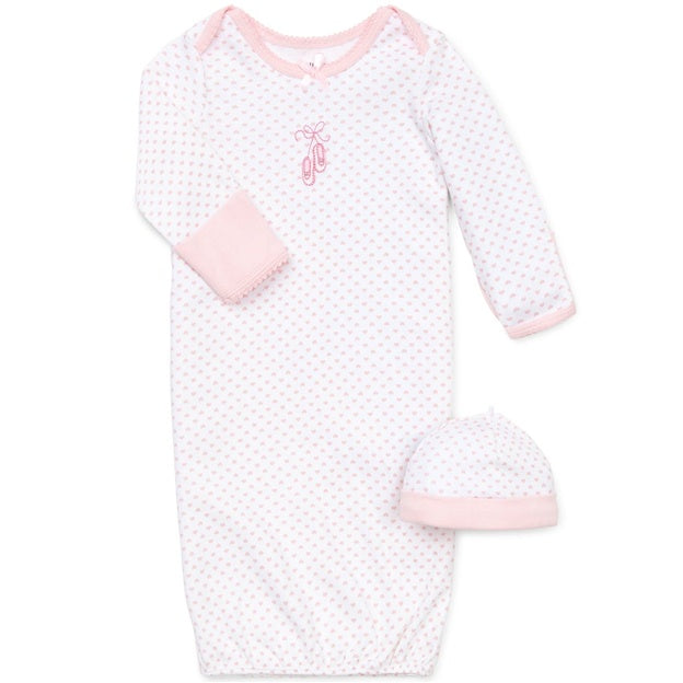 Pink baby gown with matching hat on a white background