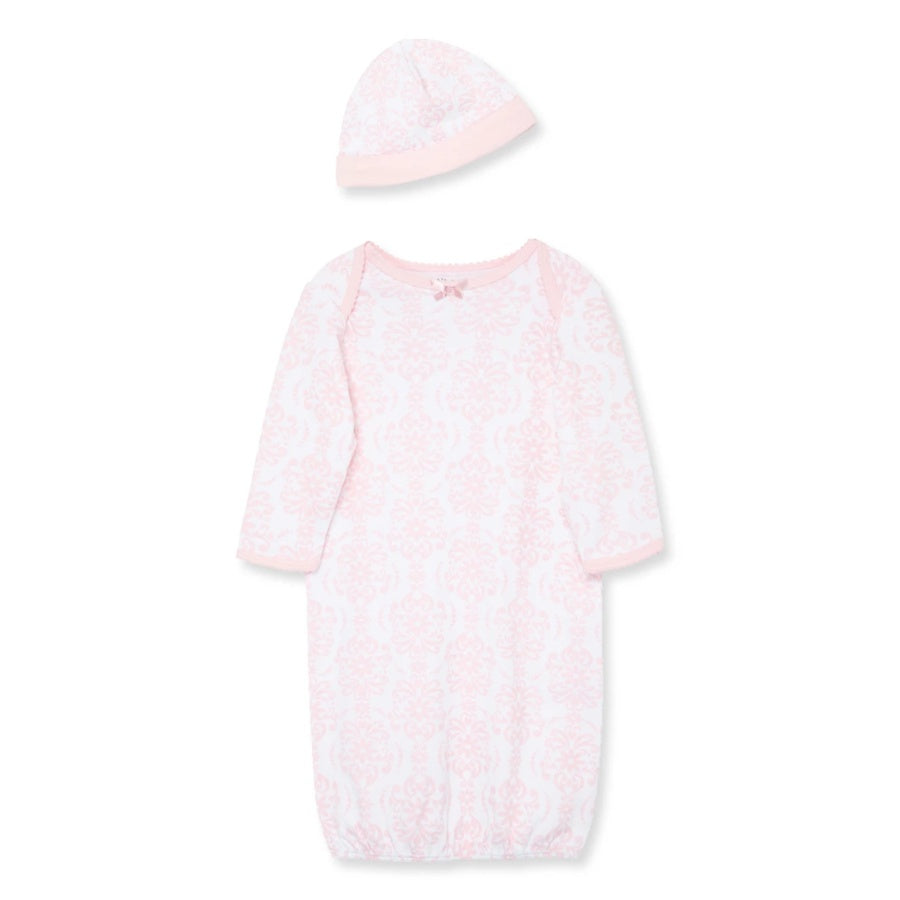 Pink baby gown with matching hat on a white background