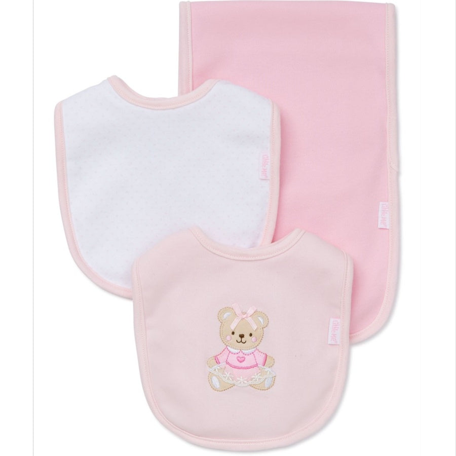 Set of pink and white baby bibs with a teddy bear design on a pink background