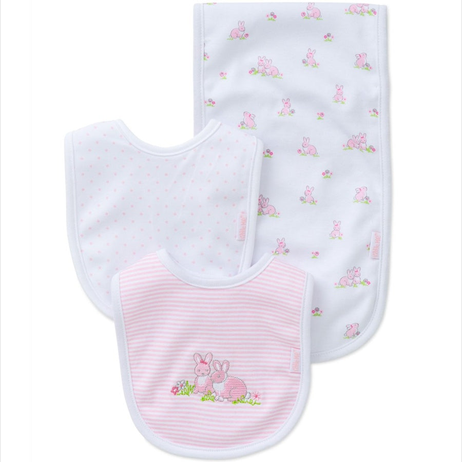 Baby bib and burp cloth set with pink and white design on a white background
