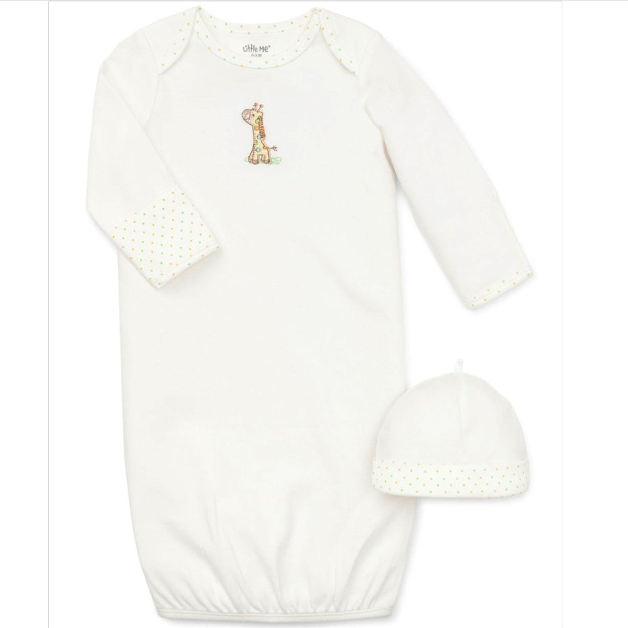 White baby onesie with long sleeves and matching hat on a white background