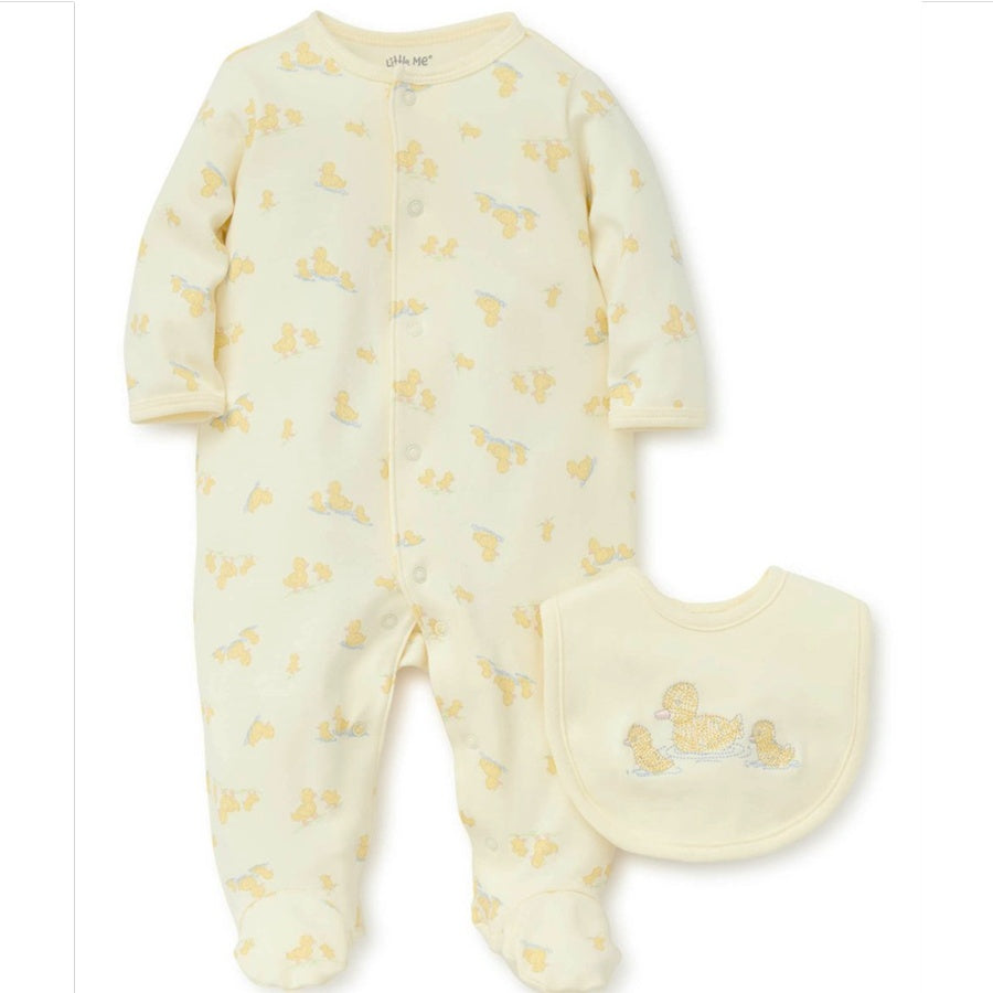 Baby onesie and bib with duck pattern on white background