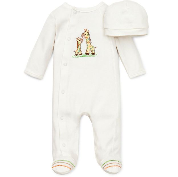 Baby onesie and hat set with giraffe pattern on a white background