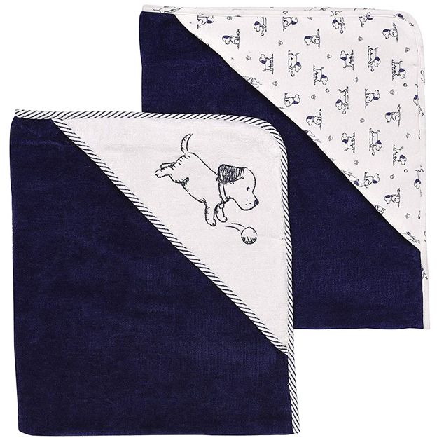 Two baby blankets, one navy with dog pattern and one white with black dog pattern, on a white background.