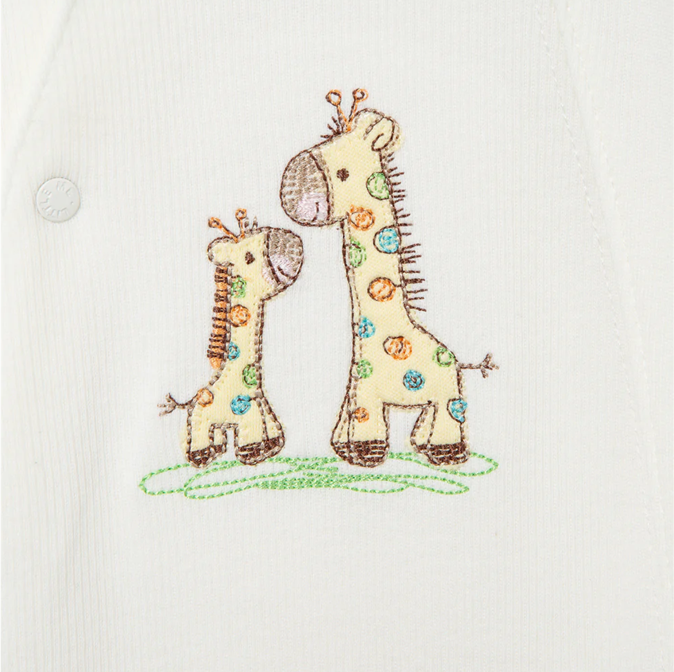 Embroidered design of two giraffes on a white fabric background