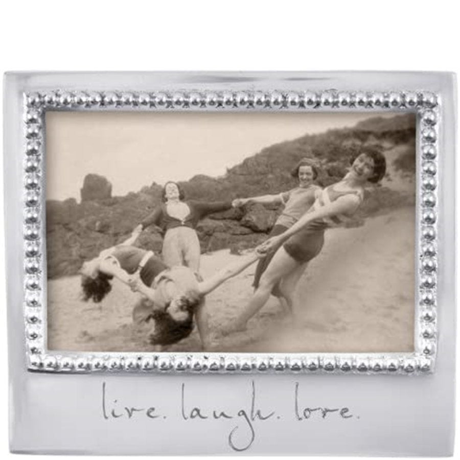 Decorative photo frame with a vintage-style photo of people on a beach and the text 'live. laugh. love.'