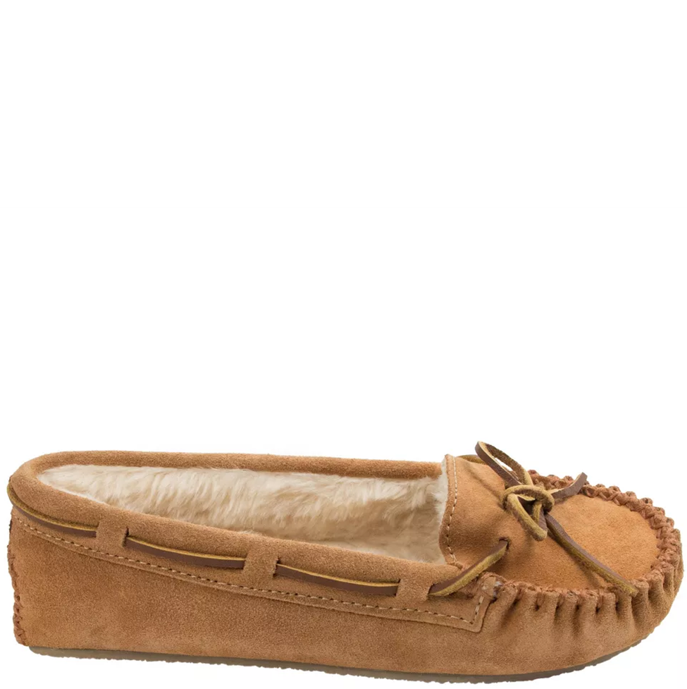 Brown moccasin slipper with a white interior on a white background
