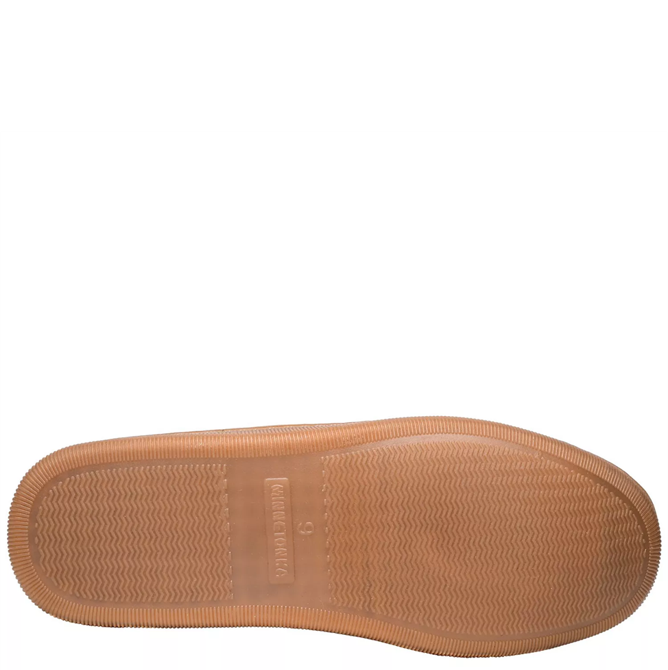 Tan shoe sole with brand logo on a white background