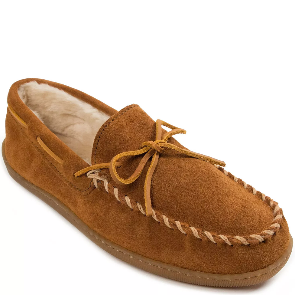 Brown suede moccasin slipper with fur lining on a white background
