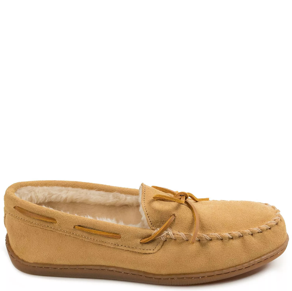 Tan moccasin slipper with shearling lining on a white background