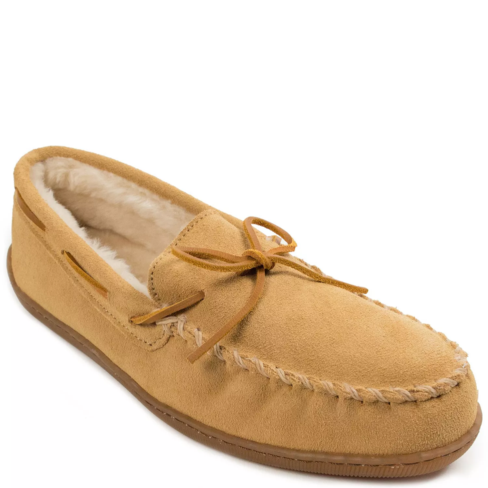 Tan moccasin slipper with fur lining on a white background
