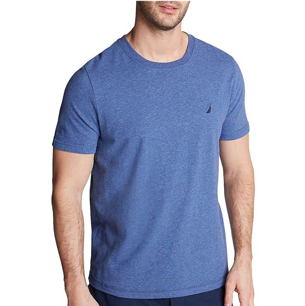 Man wearing a blue t-shirt with a small logo on a white background