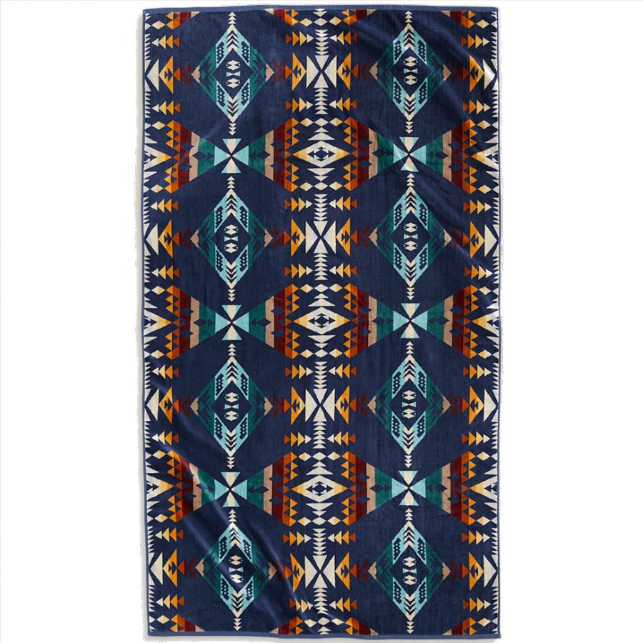 Colorful patterned rug with geometric design on a white background