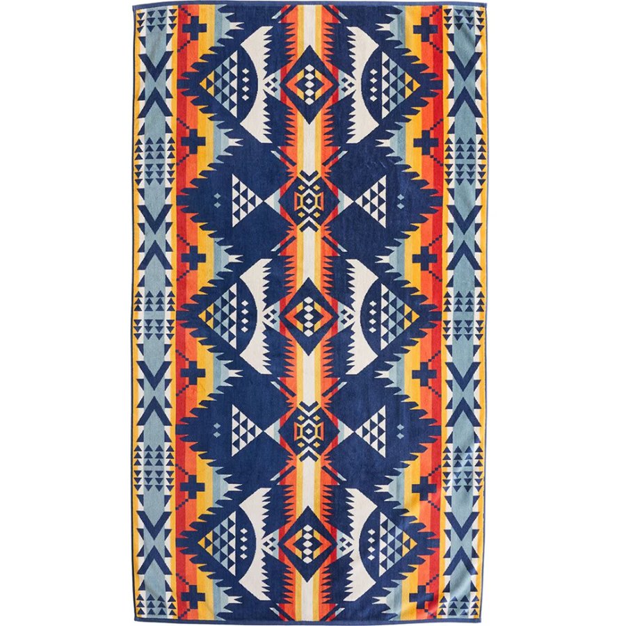 Colorful patterned rug with geometric design on a white background