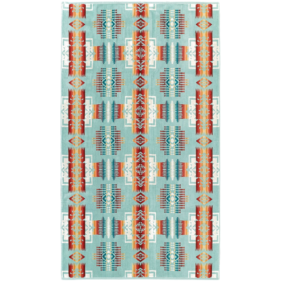 Patterned rug with geometric design on a light blue background