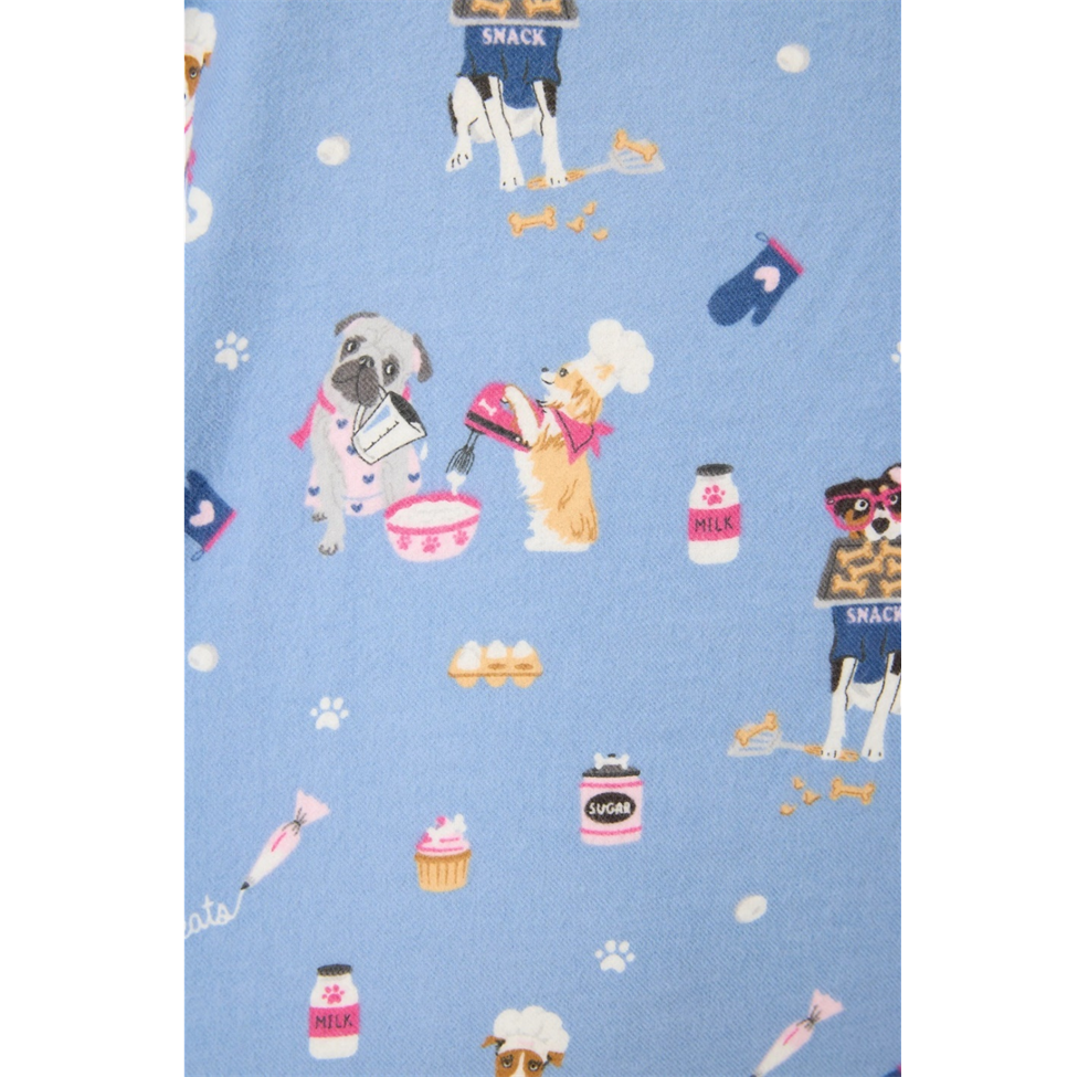 Patterned fabric with cartoon dogs and food items on a blue background