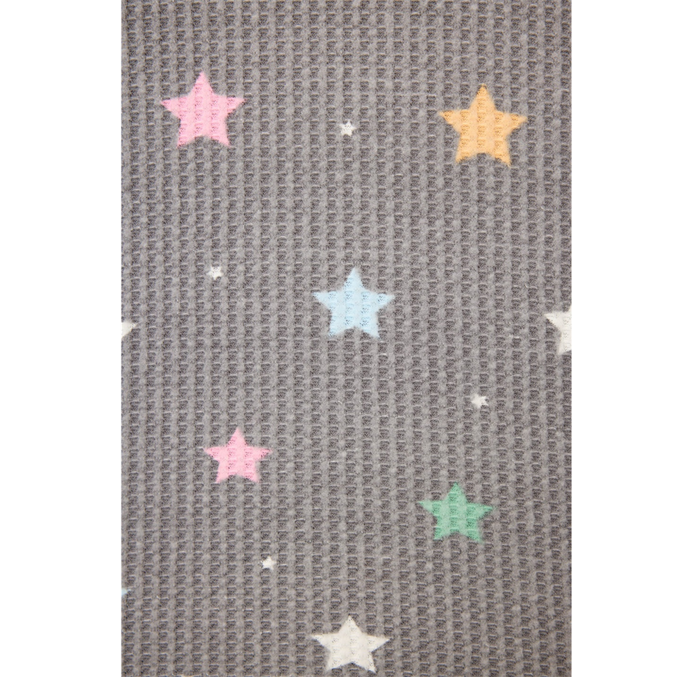 Gray textured fabric with colorful star patterns on a white background