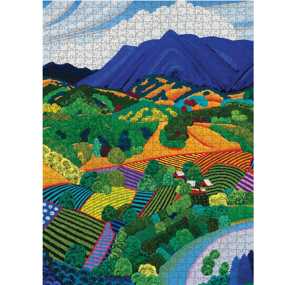 Colorful landscape puzzle with mountains and fields on a white background
