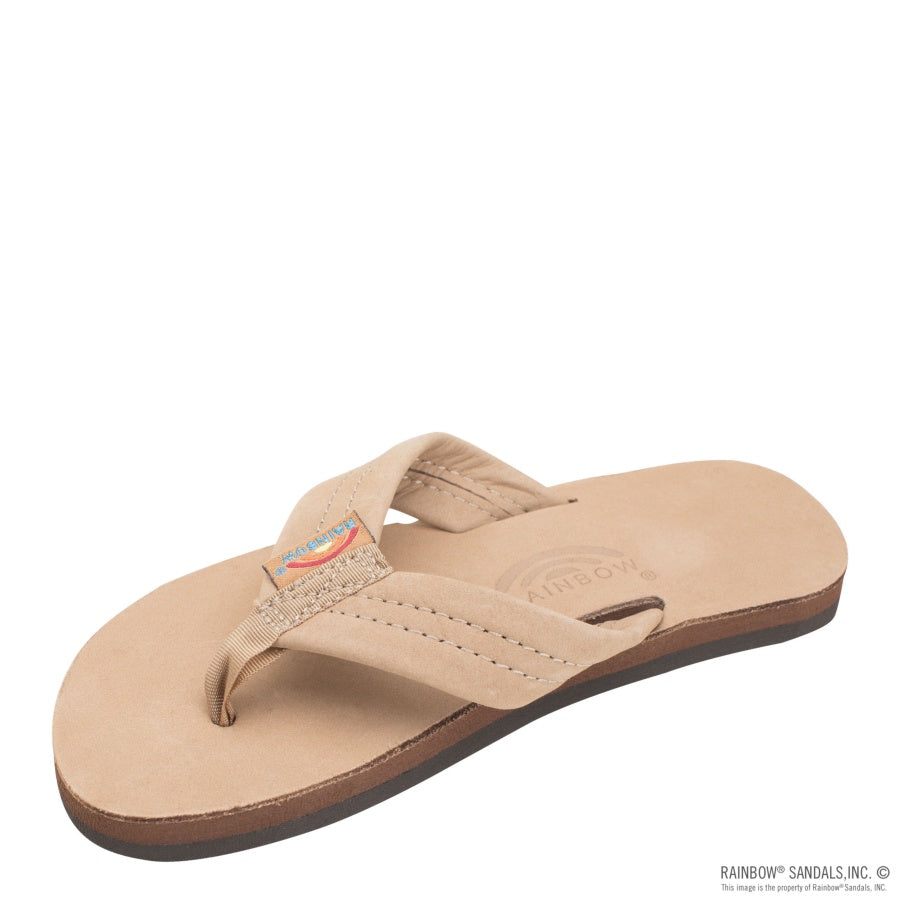 Beige sandal with a brown sole on a white background