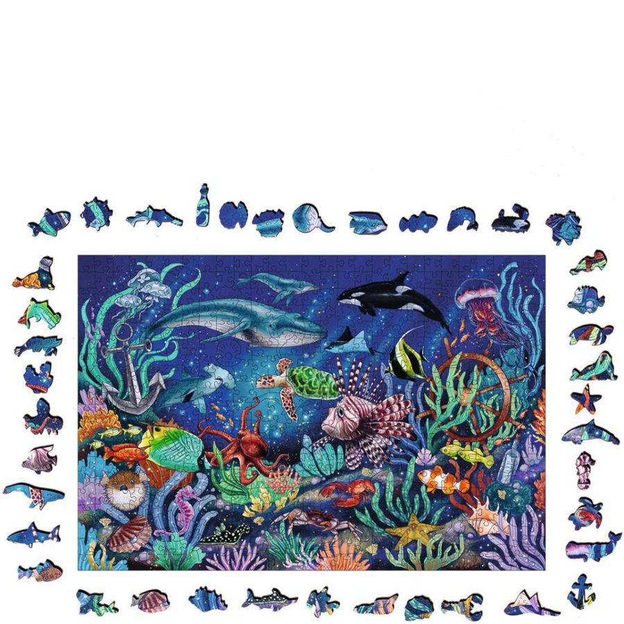 Colorful underwater scene with various sea creatures and puzzle pieces on a white background