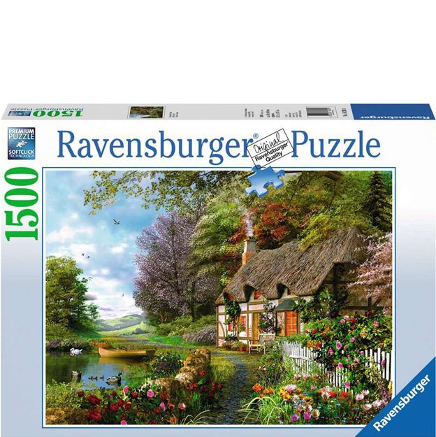 Ravensburger puzzle box with a scenic cottage and garden illustration