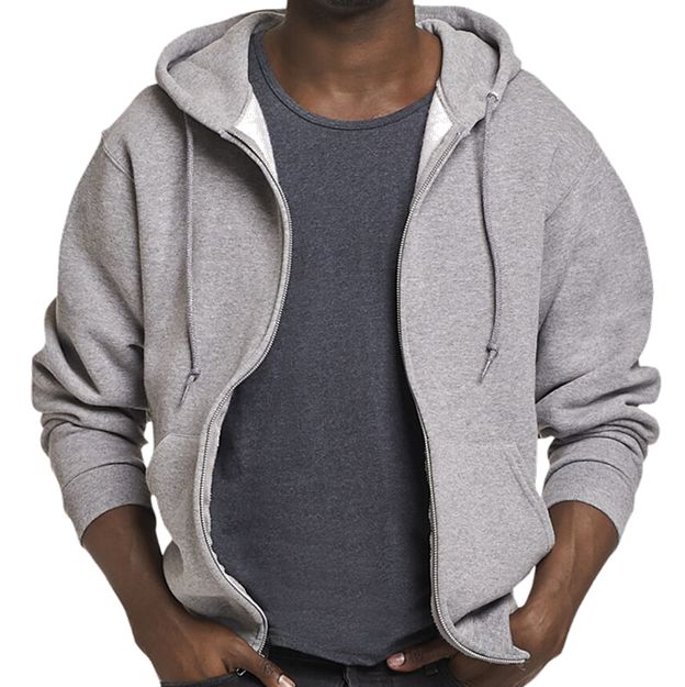 Person wearing a gray hoodie over a dark shirt on a white background