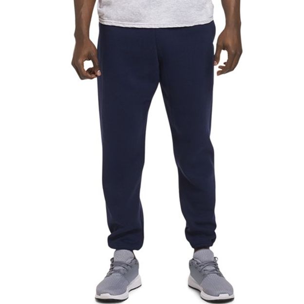 Person wearing navy blue sweatpants on a white background