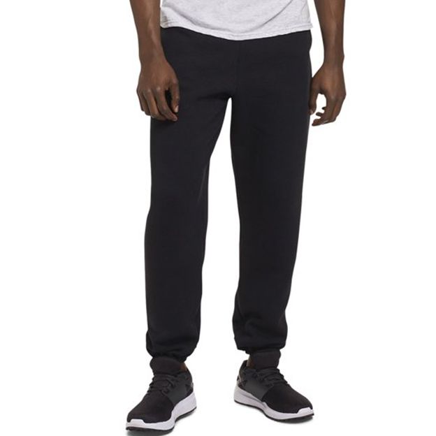 Person wearing black sweatpants on a white background