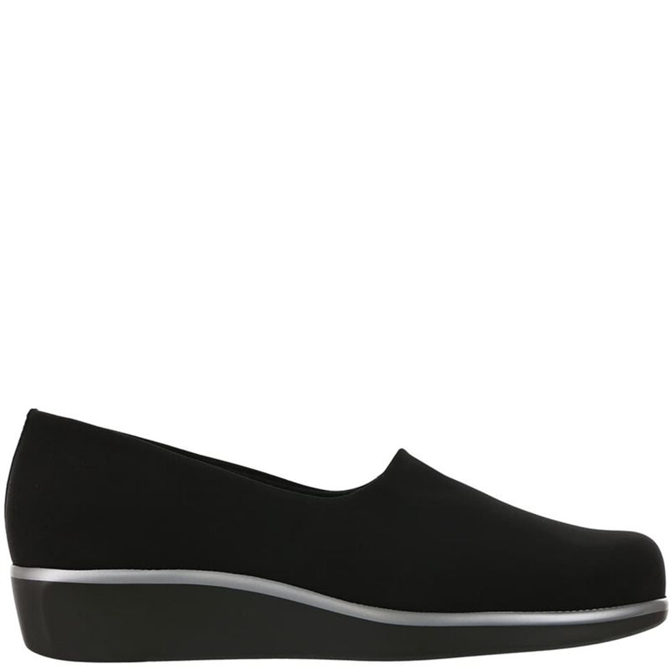 Black slip-on shoe on a white background