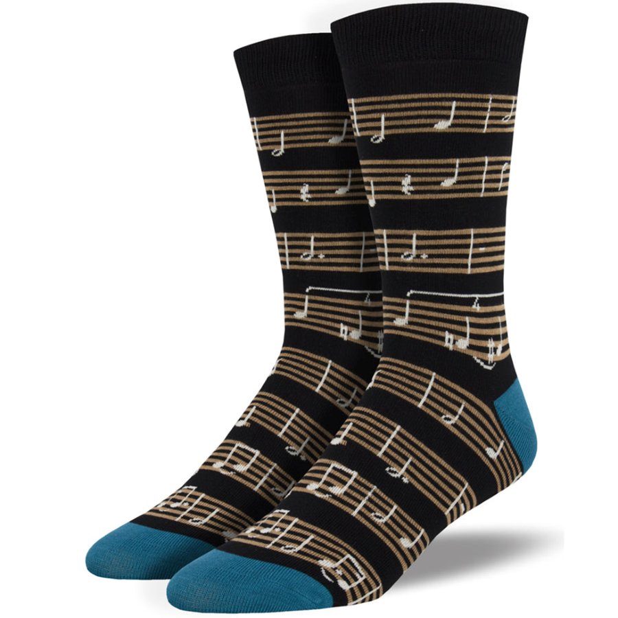 Black socks with sheet music pattern on black background