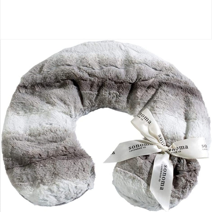 Gray plush neck pillow with a white ribbon and 'Sonoma' label on a white background