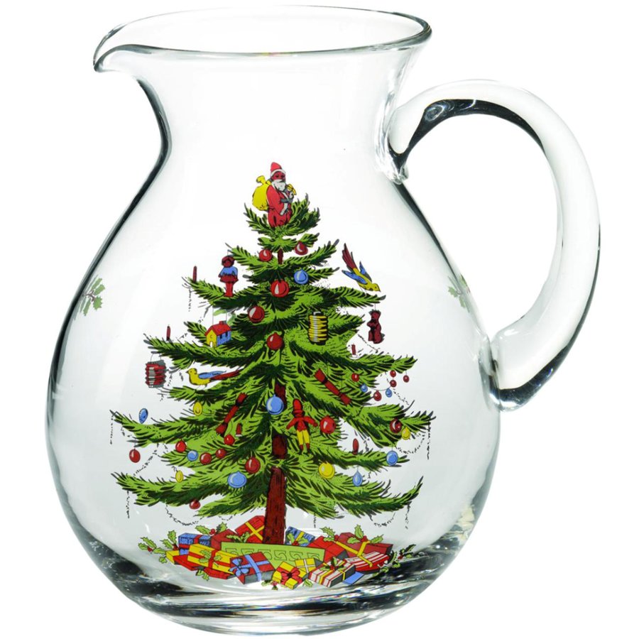 Clear glass pitcher with Christmas tree design on a white background