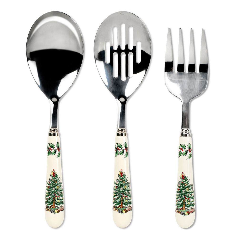 Set of three silver utensils with Christmas tree design handles on a white background