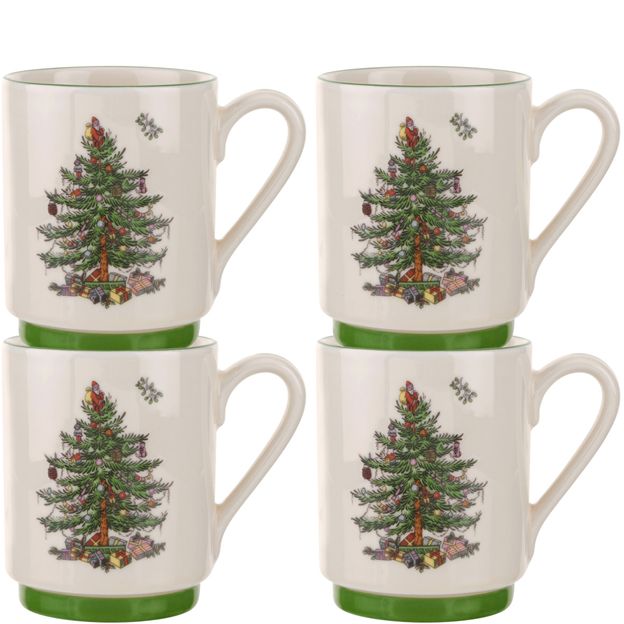 Four mugs with Christmas tree design on a white background