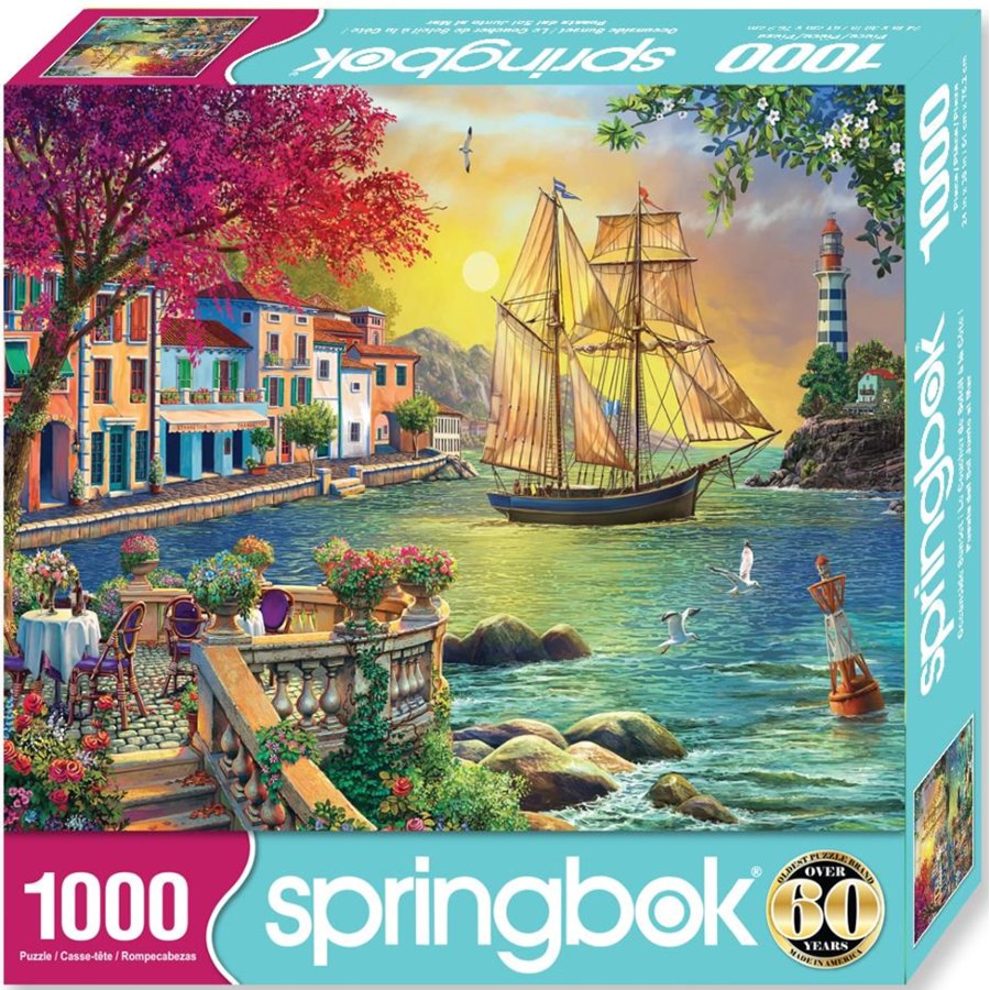 Springbook 1000-piece puzzle box with a scenic design of a village by the sea.