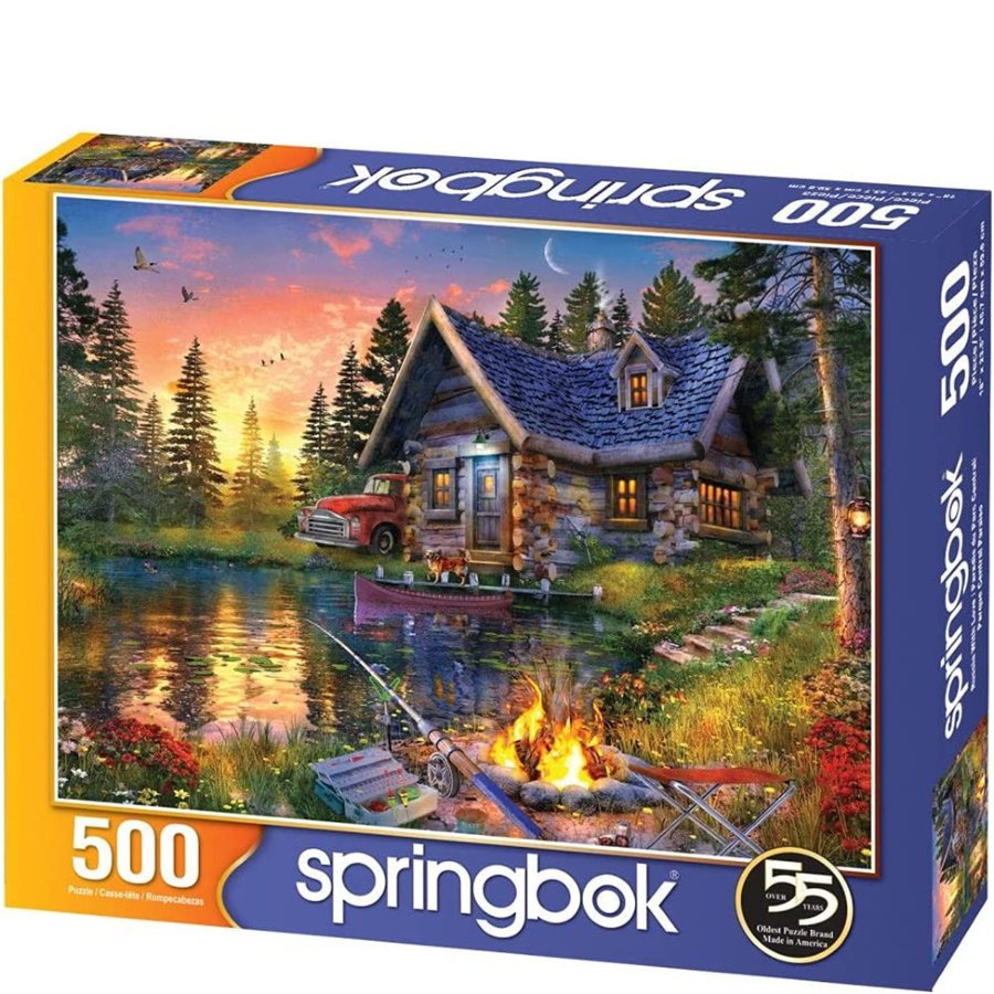Springbok 500 piece puzzle box with a cabin and lake scene
