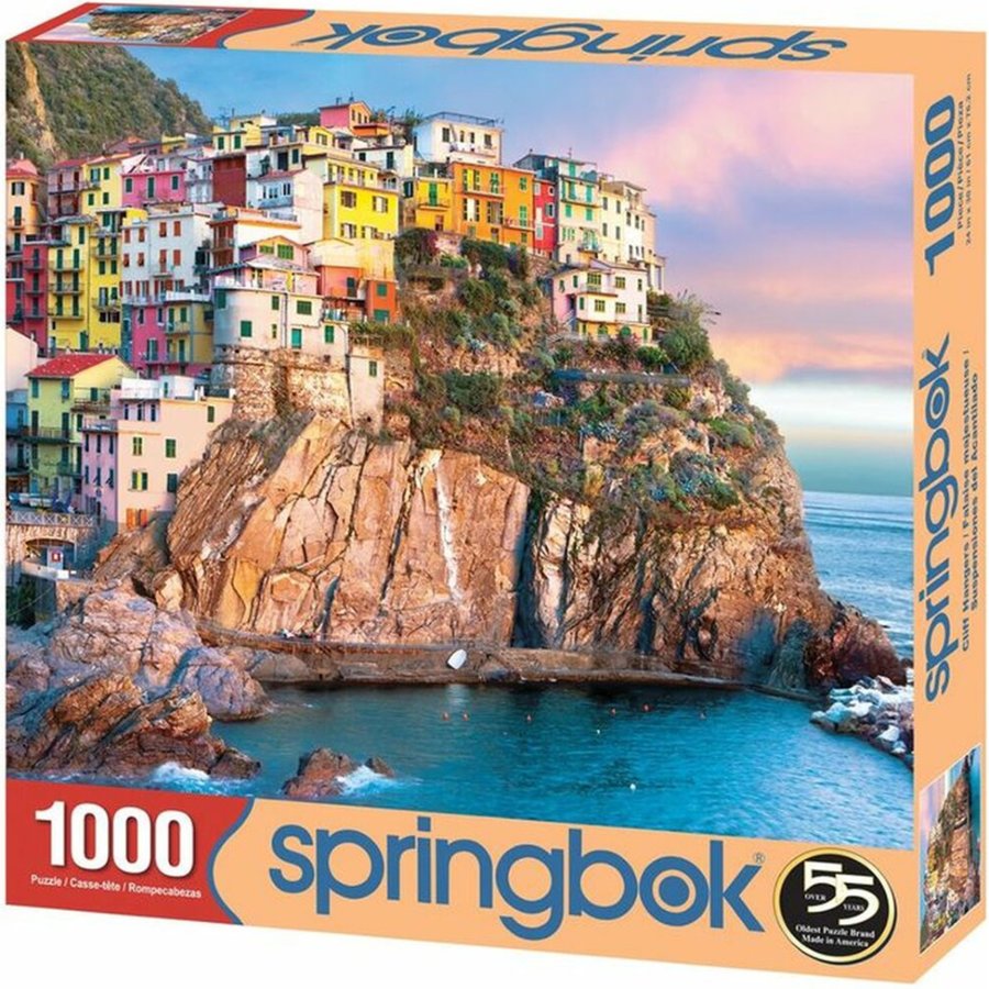 Springbok puzzle box with a scenic village on a cliff and ocean view
