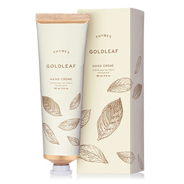 Thymes Goldleaf hand cream with packaging on a white background
