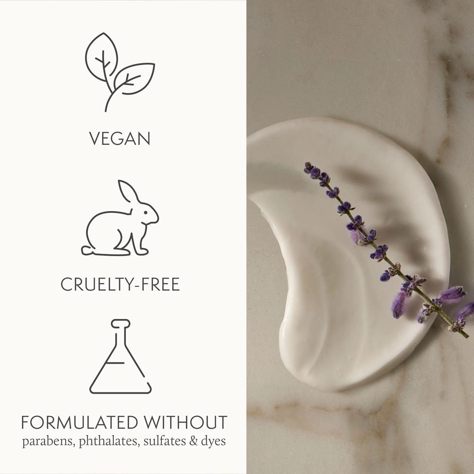 Product packaging with vegan, cruelty-free, and sulfate-free symbols on a marble background.