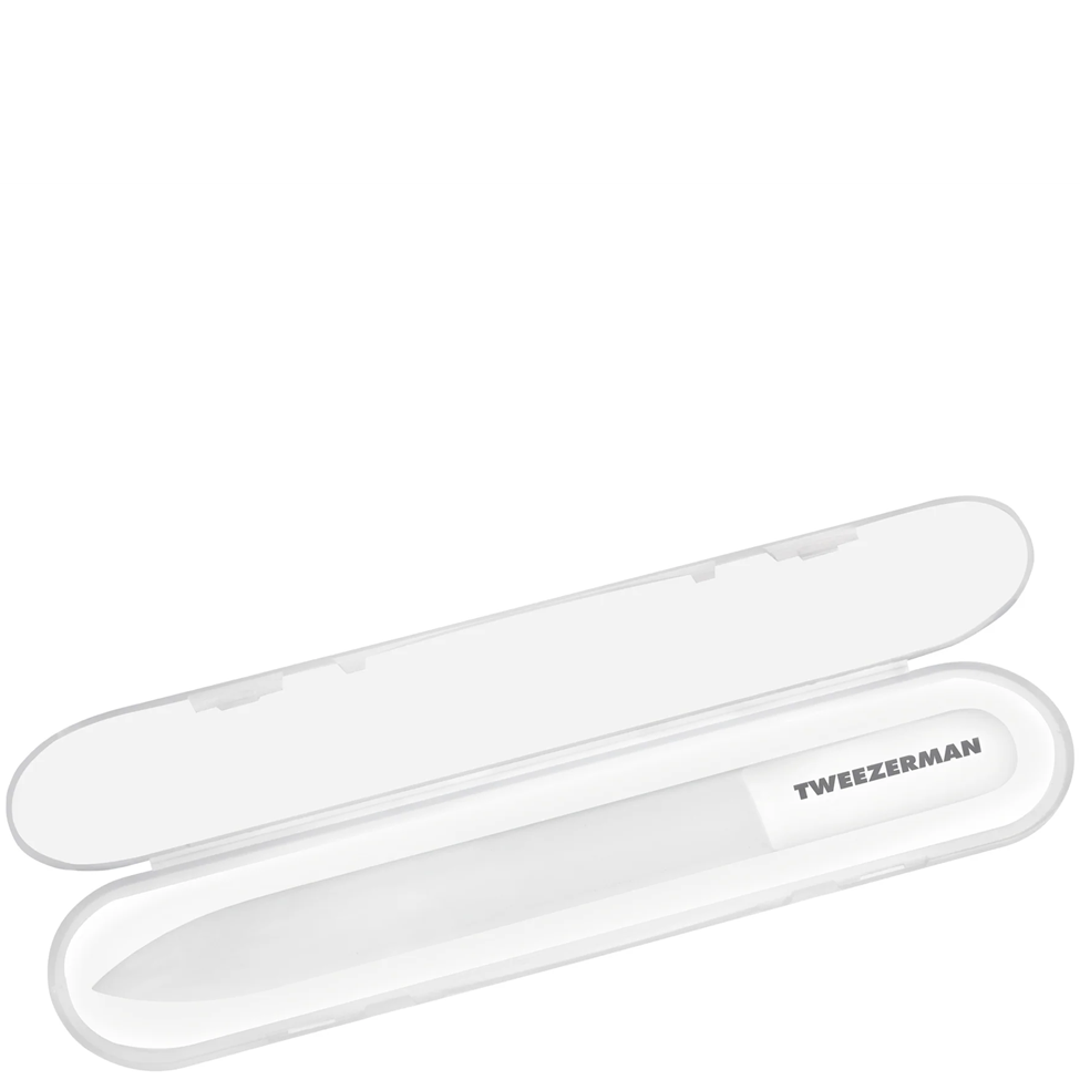 White tweezers in a Tweezerman case on a white background