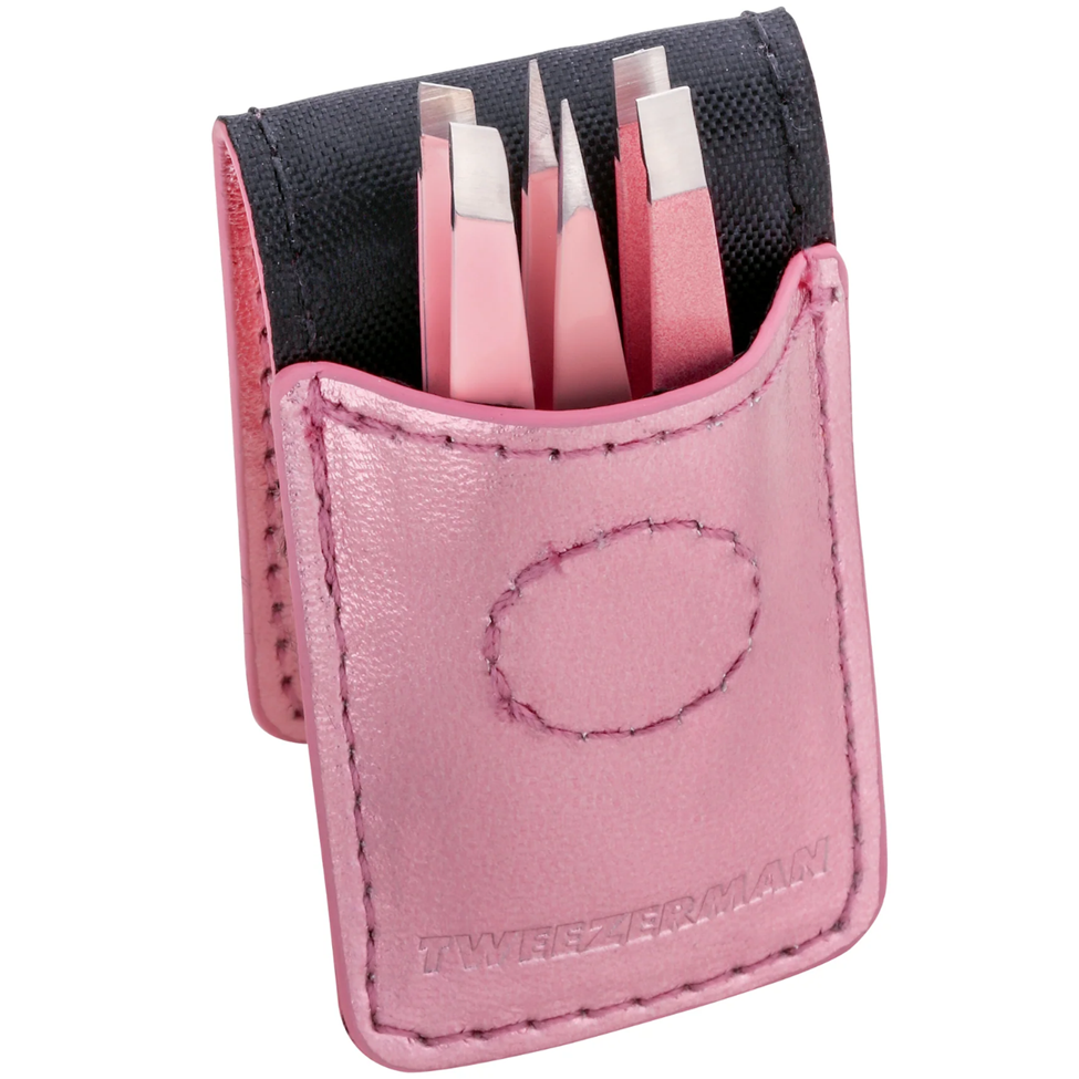 Pink case with tweezers on a white background