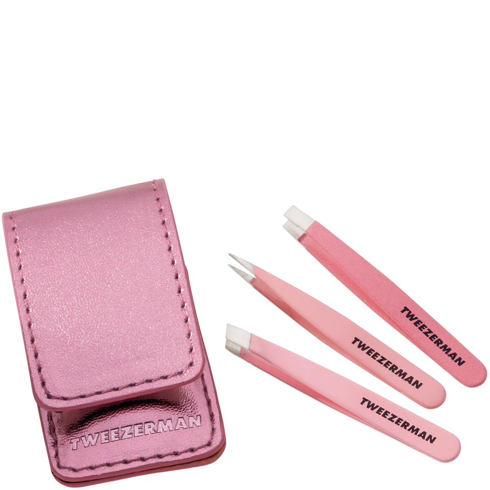 Set of pink tweezers with a pink case on a white background, featuring the Tweezerman brand.