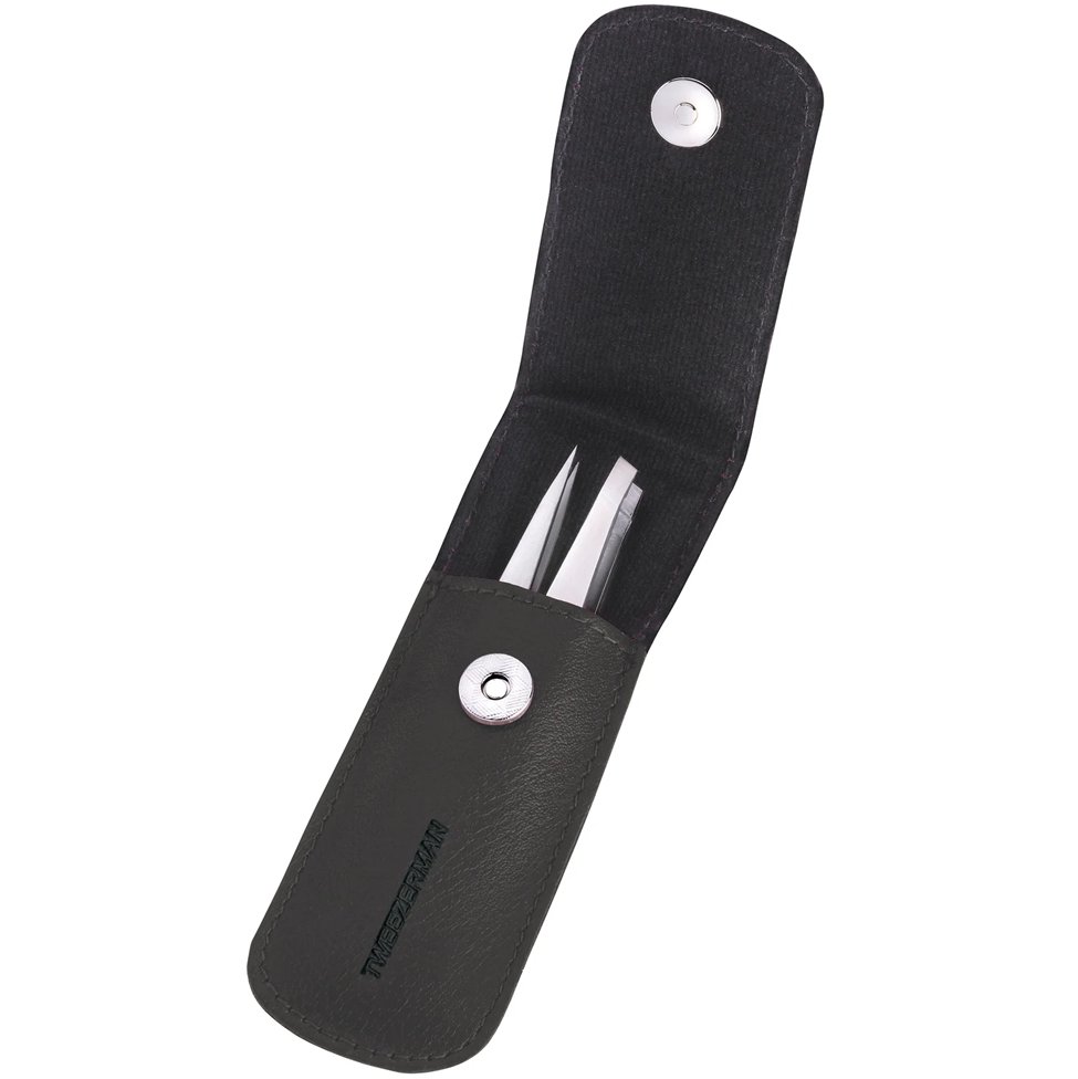Black leather case with a knife and fork set on a white background