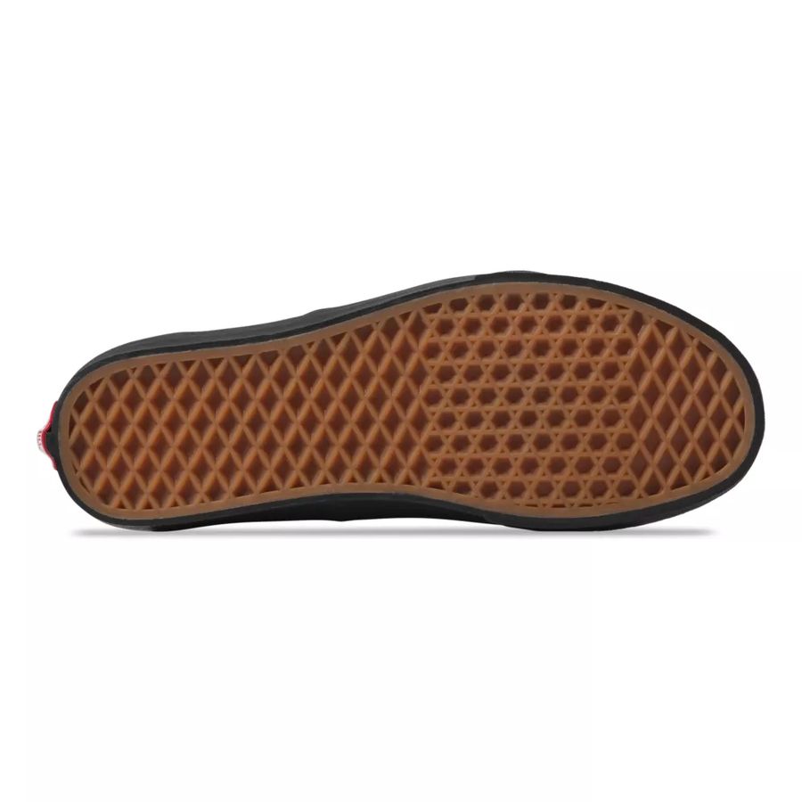 Brown waffle-patterned sole of a shoe on a white background