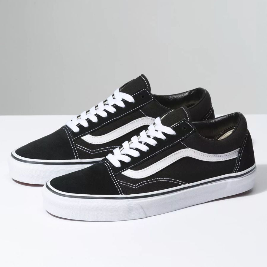 Black and white sneakers on a light gray background