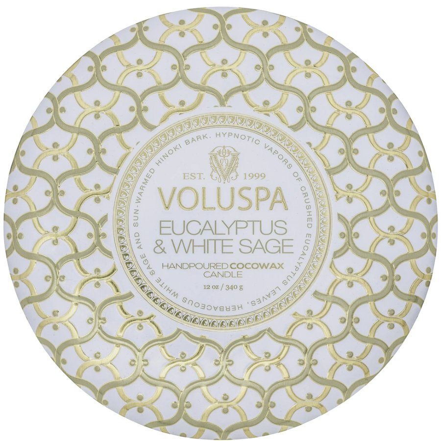 Voluspa candle packaging with gold geometric pattern on a white background